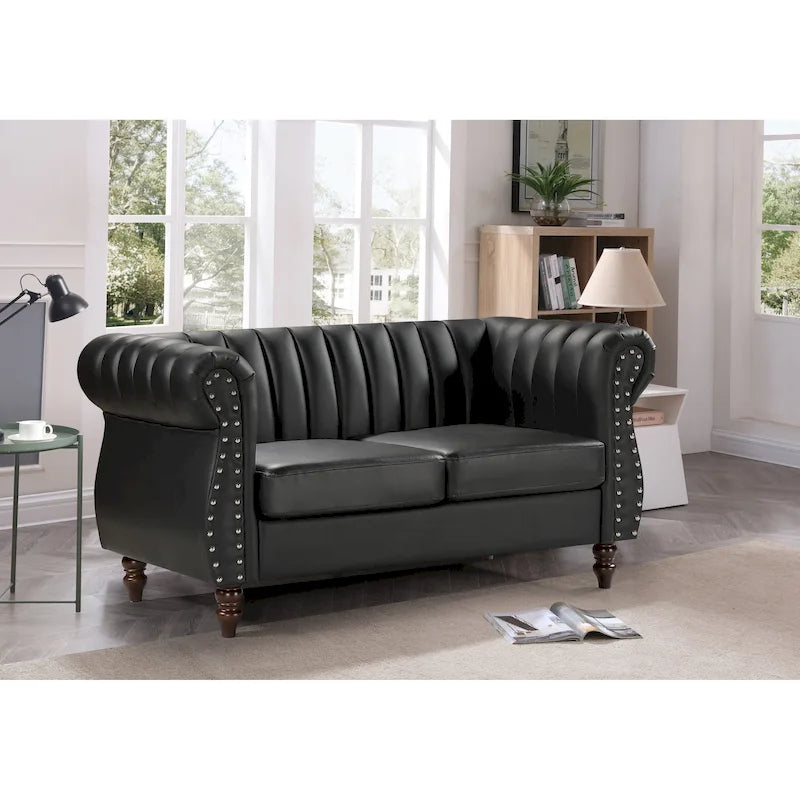 Divanetto Capri in similpelle con braccioli arrotolati Chesterfield