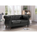 Divanetto Capri in similpelle con braccioli arrotolati Chesterfield