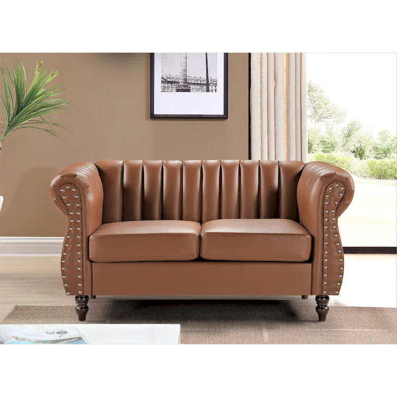 Divanetto Capri in similpelle con braccioli arrotolati Chesterfield