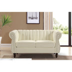 Divanetto Capri in similpelle con braccioli arrotolati Chesterfield