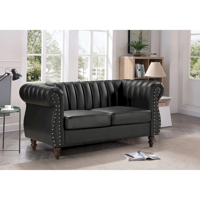 Divanetto Capri in similpelle con braccioli arrotolati Chesterfield