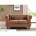 Divanetto Capri in similpelle con braccioli arrotolati Chesterfield
