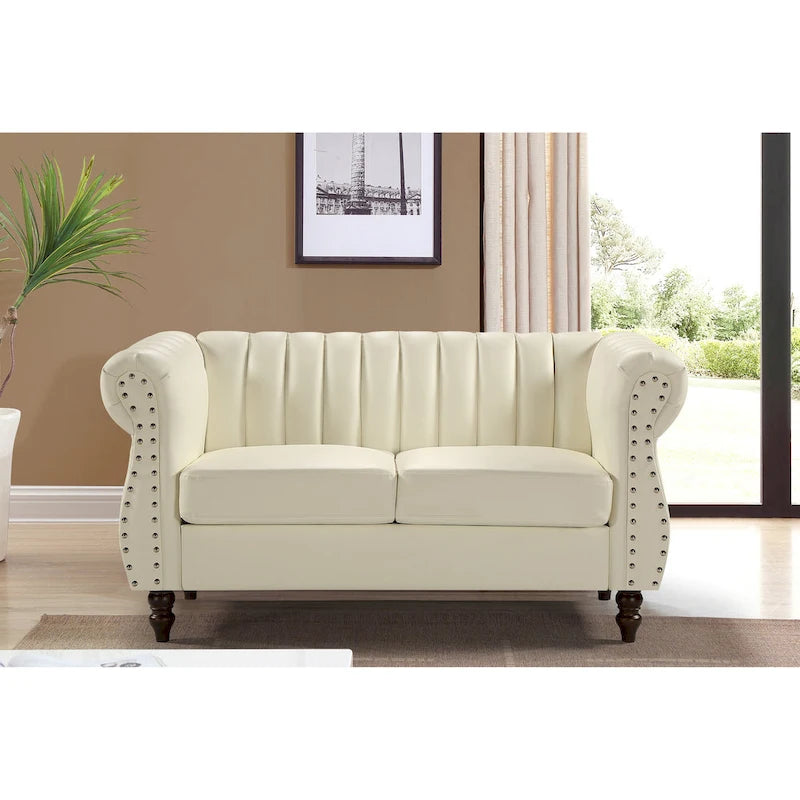 Divanetto Capri in similpelle con braccioli arrotolati Chesterfield